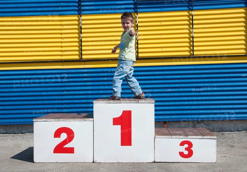 Little boy on the podium. First place