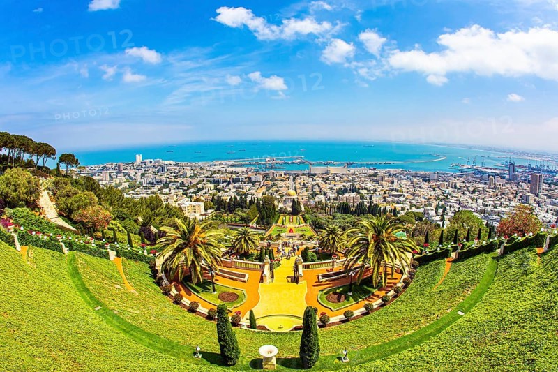 HAIFA, ISRAEL - MAY 6, 2017: Bahai World Center. View from Mount Carmel to the seaport of Haifa. Pilgrimage center and popular tourist destination. Sunny day by Mediterranean Sea
