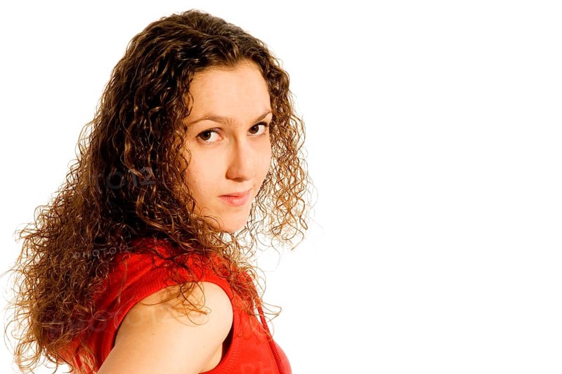 Portrait of a shy girl in red