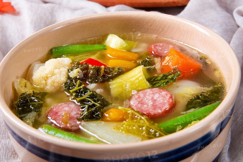 Delicious autumnal vegetable soup with sausage and bacon