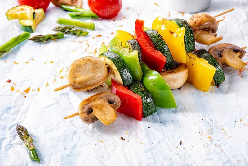 Vegetarian skewers white mushrooms, peppers and zucchini for barbecue