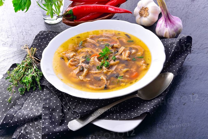 Traditional Politur-style tripe soup with beef and vegetables
