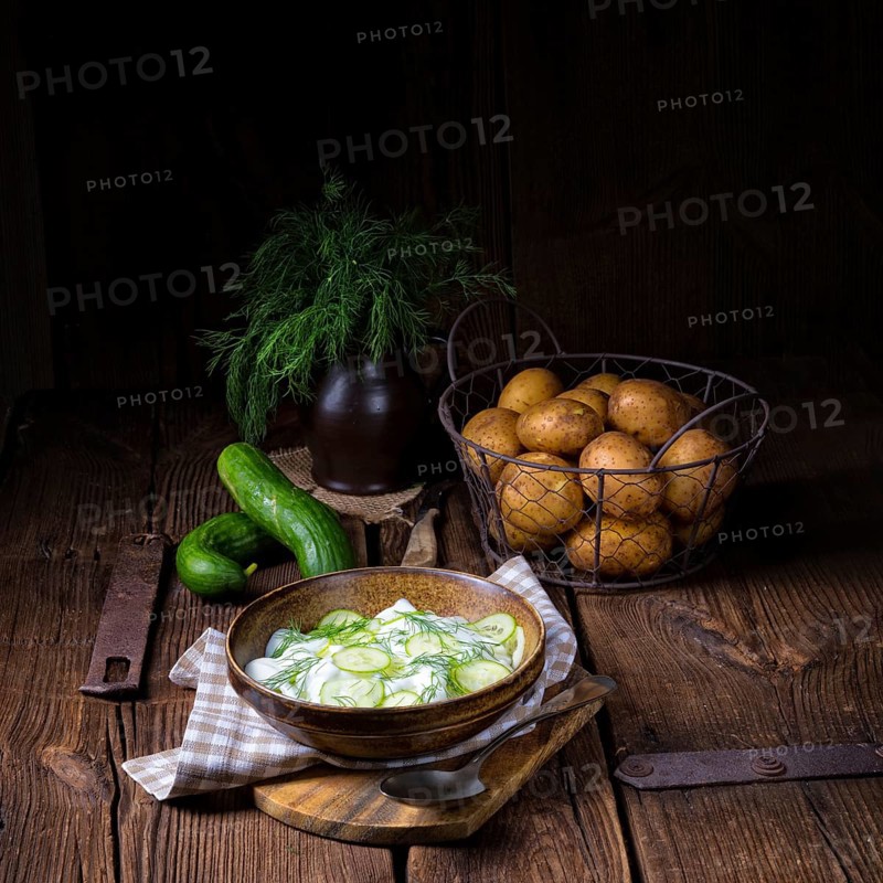 Fresh cucumber salad with yoghurt and young potatoes