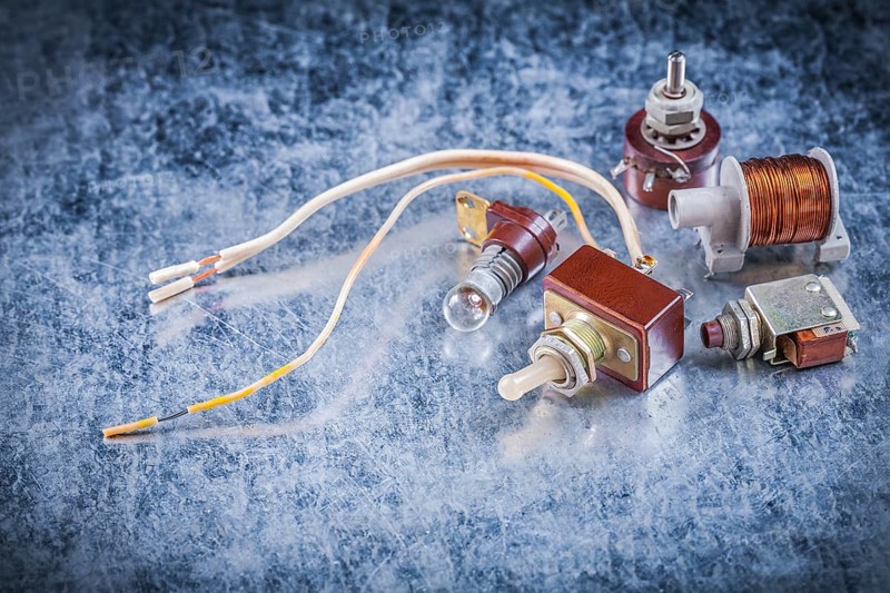 Group of electric devices on metallic background vintage electricity concept