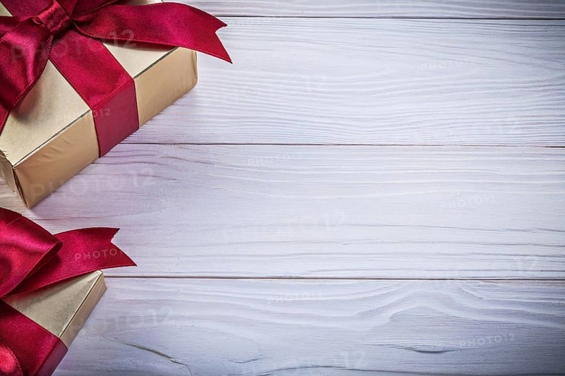 Box-containers with presents on wooden board copy space holidays concept
