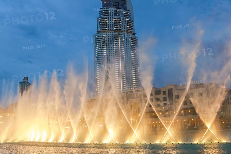 The Dancing Fountain of Dubai performs to the beat of the music at night show on lake area