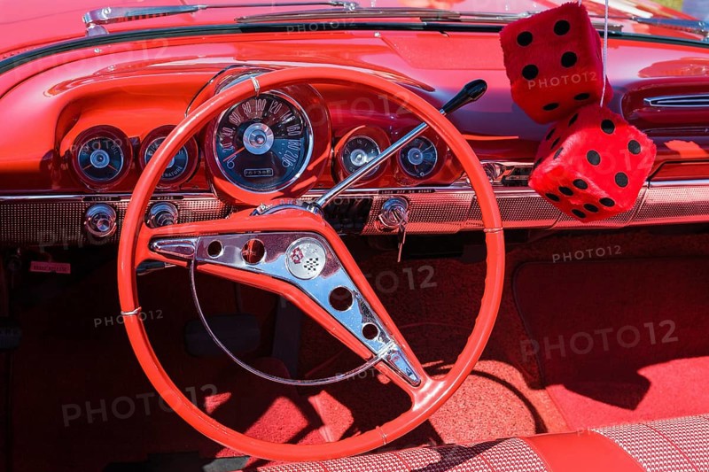 Red car interior with red dice