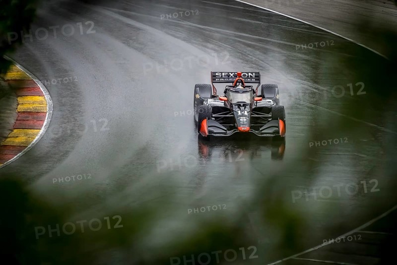SANTINO FERRUCCI (14) of Woodbury, Connecticut comes through turn 12 (Canada Corner) during a wet practice session for the XPEL Grand Prix at Road America in Elkhart Lake, WI
