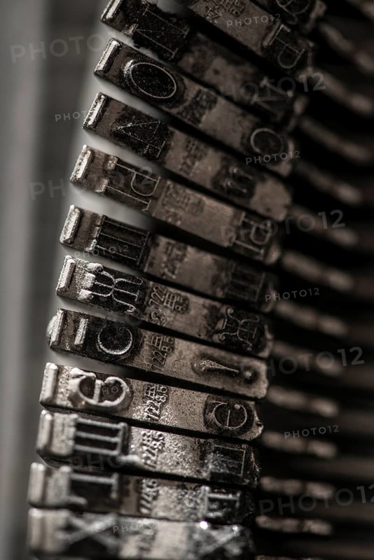 Metal letters on typewriter. Close up macro