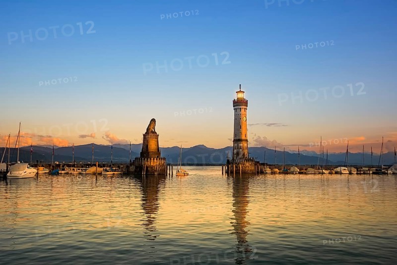 Harbour entrance of Lindau with lighthouse and sculpture of lion Lindau, Germany