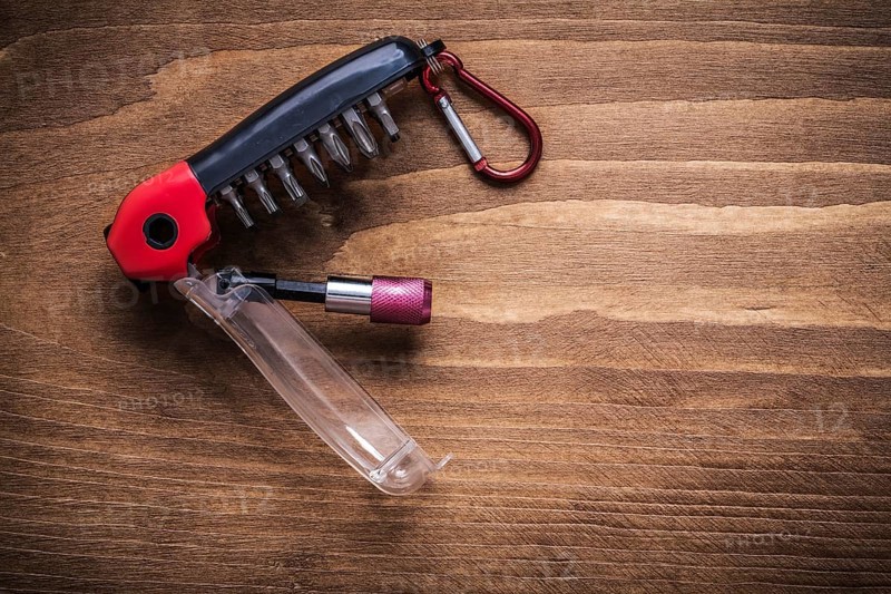 Replaceable screwdriver heads on wooden board construction concept