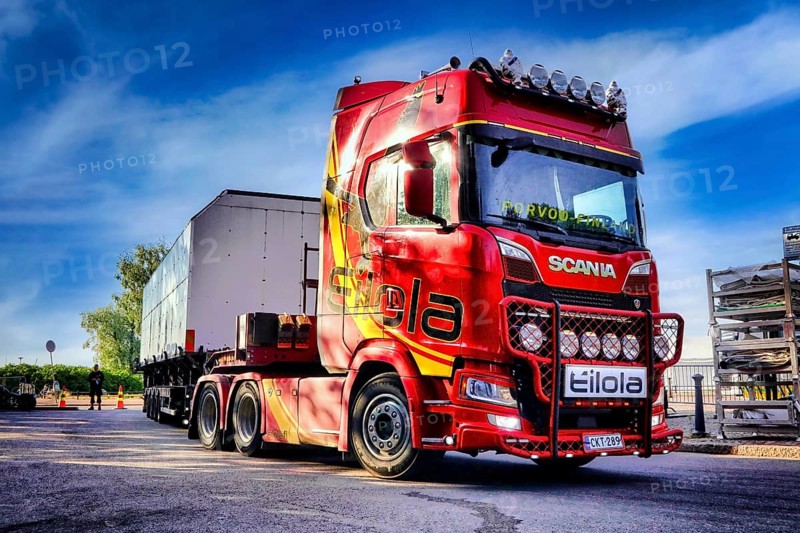 Red Next Generation Scania truck in front semi trailer of Eilola Logistics Oy, special transport. Helsinki, Finland. July 27, 2021., Filtered image
