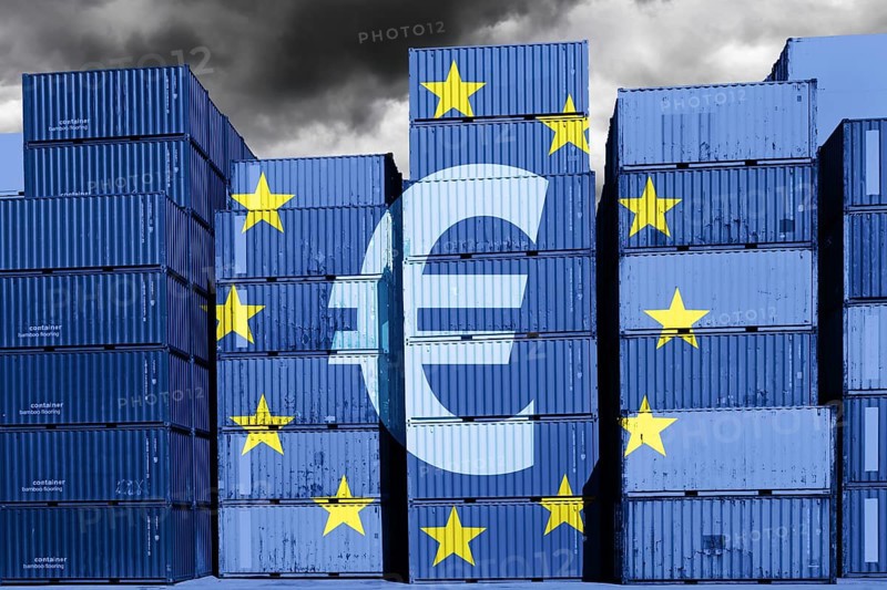 Stacked containers with EU flag and euro sign, customs duties levied on deliveries from low-cost traders to Europe, photomontage
