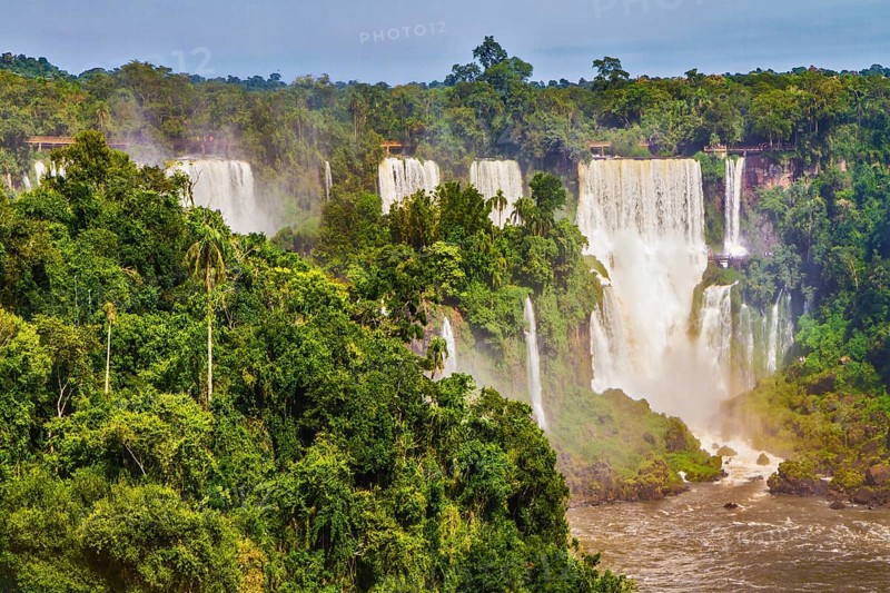 Iguazu Falls National Park - grandiose complex of waterfalls on the border of Argentina, Brazil and Paraguay. Several picturesque waterfalls. The concept of extreme and exotic tourism