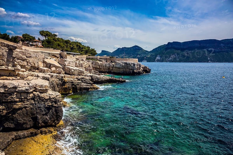 Abrupt stony coast and turquoise sea surface. Famous National Park Calanques on the Mediterranean coast