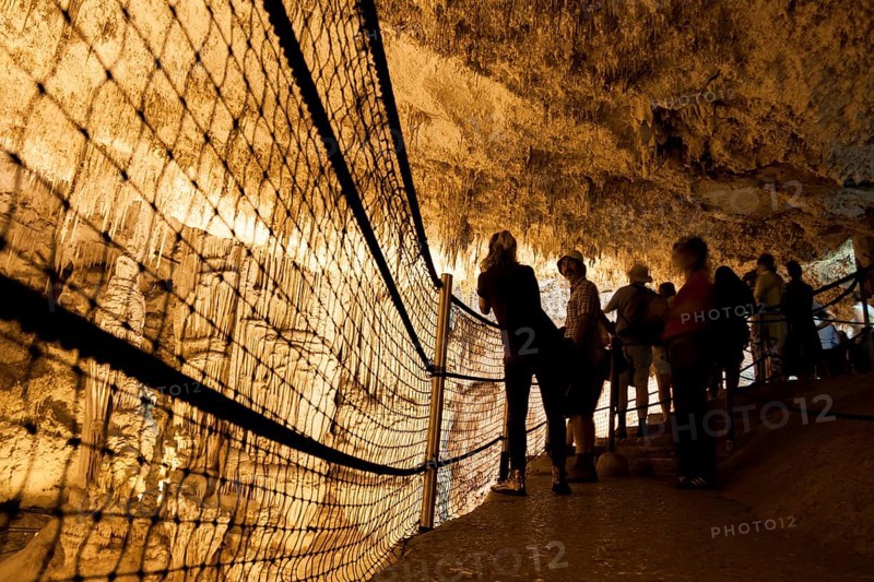 Tourists admire the incredible cave of Neptune. Alghero, Sardinia. Italy