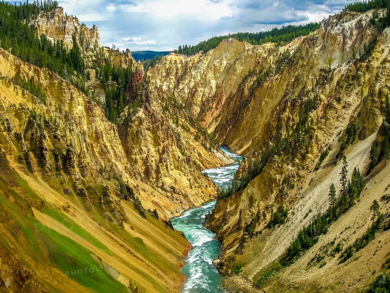 Lower Falls, most popular waterfall in Yellowstone, are located in head of the Grand Canyon in Yellowstone River. The yellow rocks gave name of Yellowstone National Park, Wyoming, United States