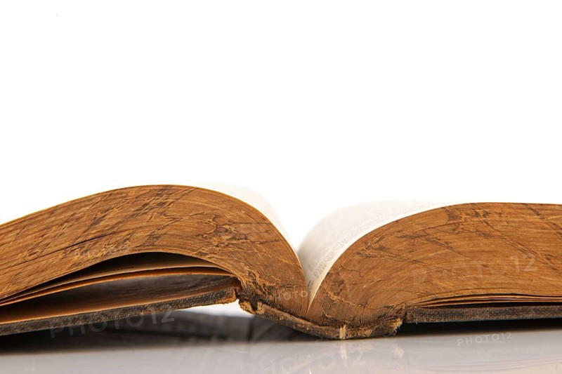 Old open book isolated over white background