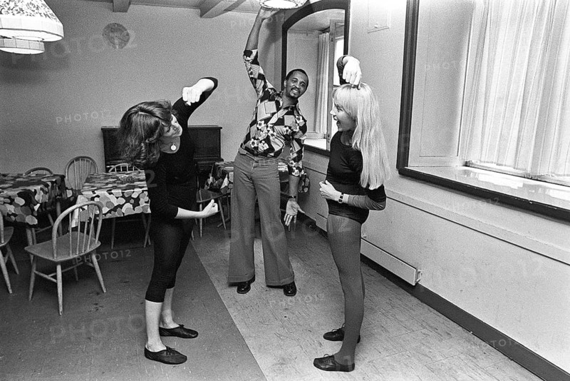 The pop group ABBA. Its two female members Anni-Frid Lyngstad and Agnetha Fältskog practice and train in preparation for the upcoming folk park tour in 1975. Choreographer Graham Tainton leads the exercises. He was a choreographer for Abba. 1975
