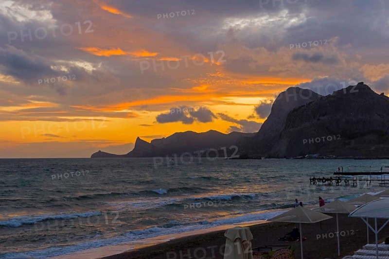 Sunset in the bay of the resort town of Sudak. Crimea