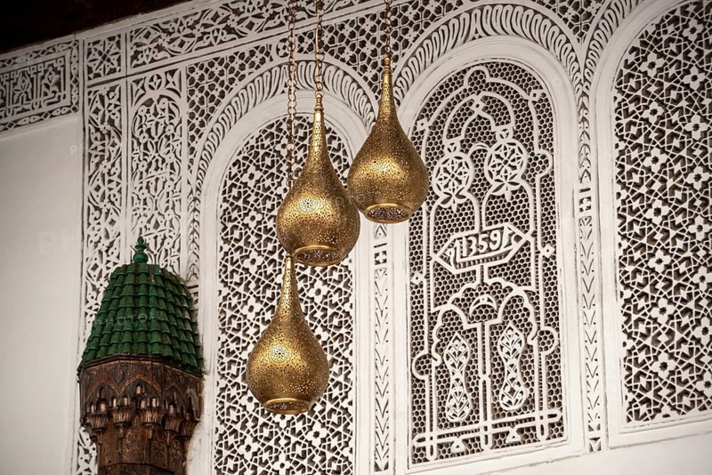 MARRAKECH, MOROCCO, ARIL 10, 2023, Three brass lamps in a typical palace in Marakesh, Morocco