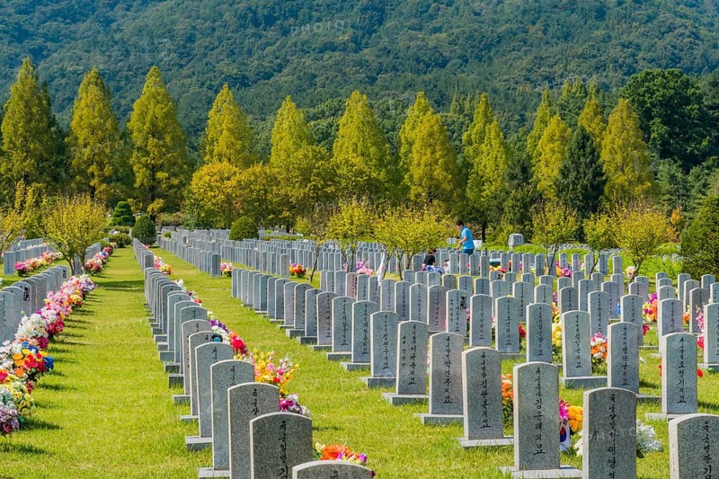 Daejeon, South Korea, September 29, 2019: Family gathered at grave of loved one to pay respect at National cemetery
