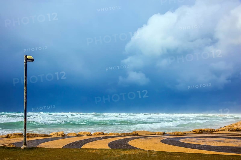 Mediterranean rages. Quay in Tel Aviv in stormy January day