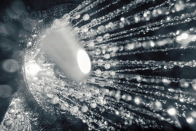 Shower head with flow of water closeup