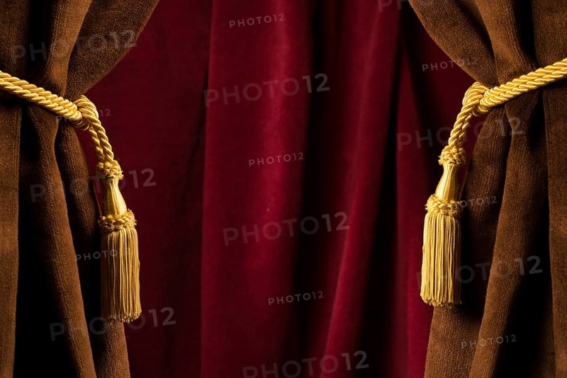 Red theatre curtains and yellow tassels