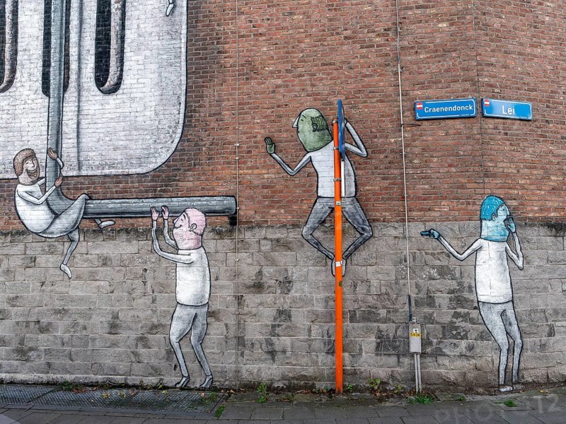 Large wall graffiti on the brick wall of buildings in Craenendonck Street, Leuven, Flemish Brabant region, Belgium
