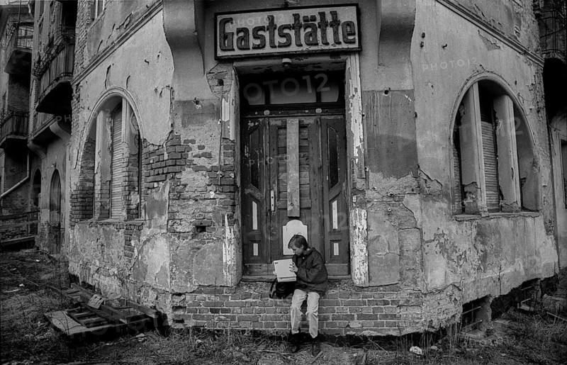 Germany, Berlin, 12 February 1992, closed restaurant in Köpenick, child with book