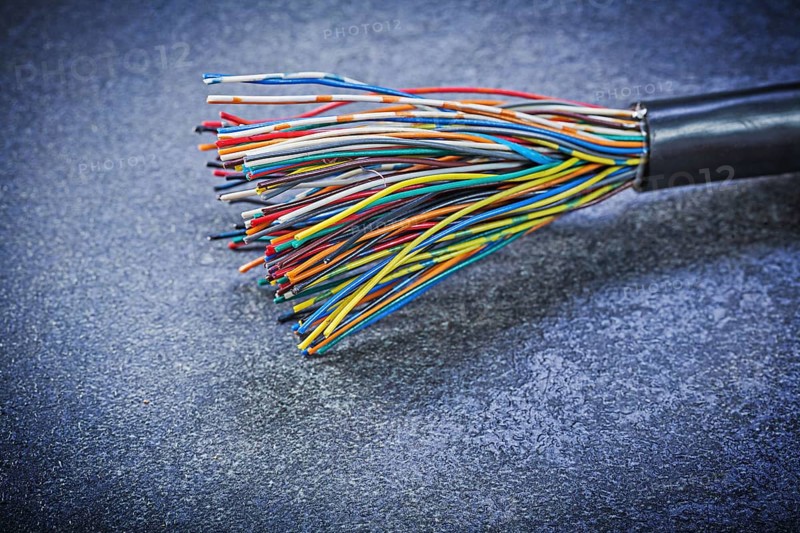 Multicolored electric cables on black background electricity concept