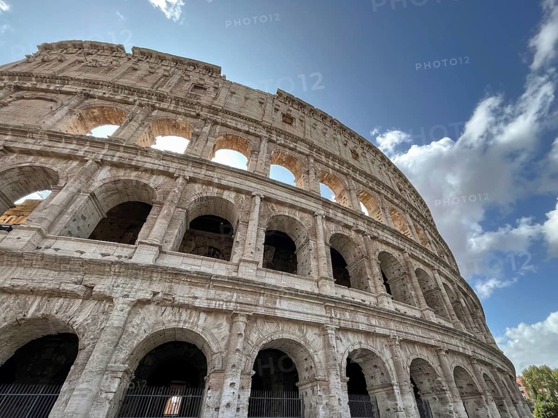 Majestic Colosseum, taken from below with a view of its arches and the sky, Rome, Italy