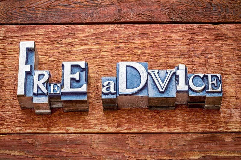Free advise word abstract in letterpress metal type against rustic barn wood