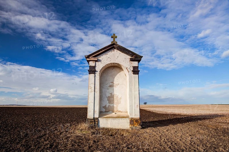 A small chapel in the middle of autumn fields