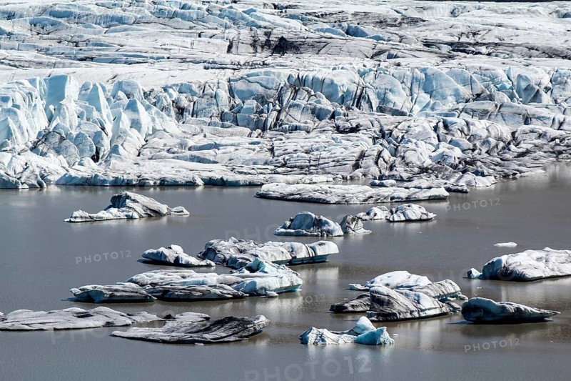 Close-up of Skaftafell glacial tongue, small icebergs in the lake, Iceland