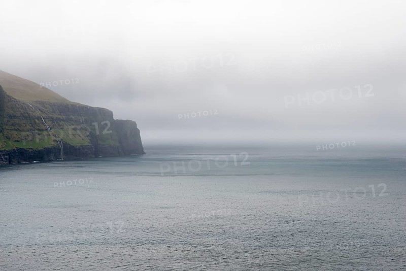 Rocky landscape on the Faroe Islands with cliff and ocean, Eidi, Faroe Islands, Denmark