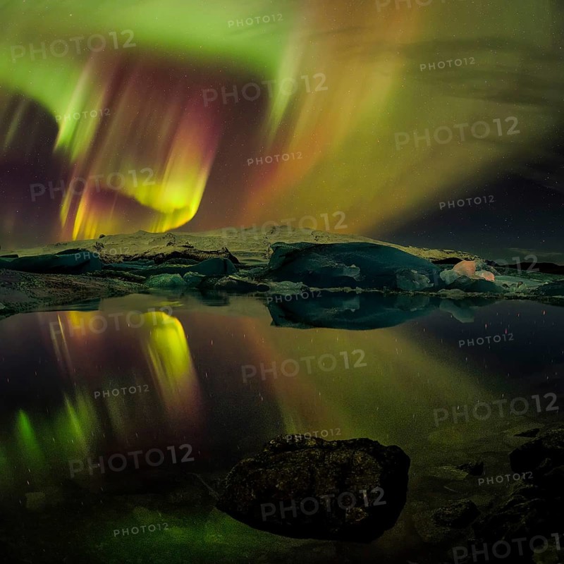 Northern lights aurora in Jokulsarlon glacial river lagoon