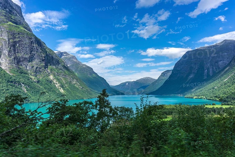 The Kjenndalsbreen is part of the Jostedalsbreen, one of the largest glaciers in Norway, and forms an impressive mountain landscape with a beautiful lake in Sande. The glacier Kjenndalsbreen with a lake in Norway is a beautiful place to travel to in summertime