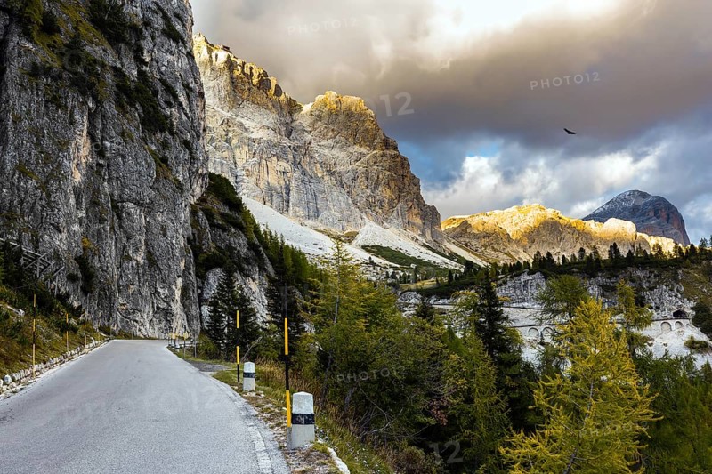 Beautiful asphalt road. The Falzarego Pass is located in the Dolomites. North of the Veneto region, Italy. The concept of active, exotic and photo tourism
