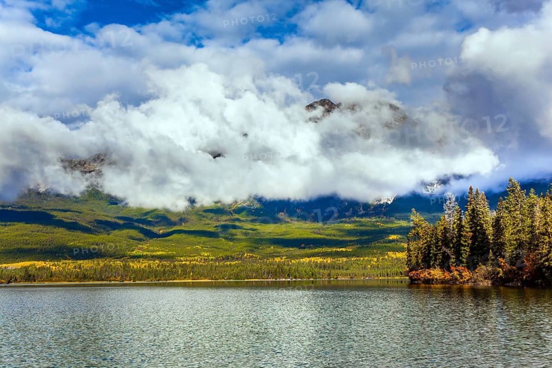 The lake is covered with light water ripples. Pyramid Lake. Cold sunny day in the Rocky Mountains of Canada