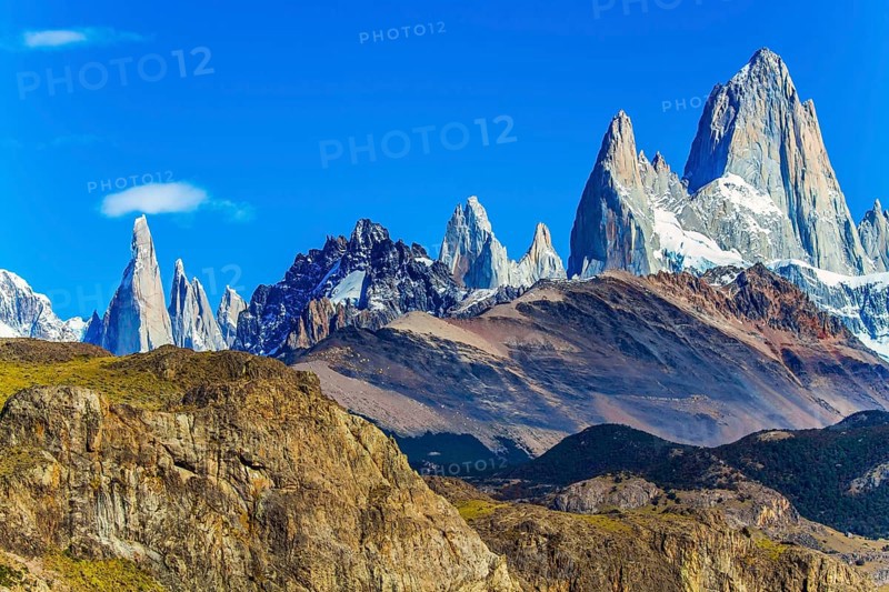 Picturesque mountain range, illuminated by the midday sun. Fitzroi - mountain peak in Patagonia in the border area between Argentina and Chile. The concept of extreme, active and photo tourism