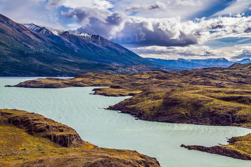 Azure lake Pehoe between rocks Los Kuernos. National Park Torres del Paine. Travel in Chile. The concept of active and extreme tourism