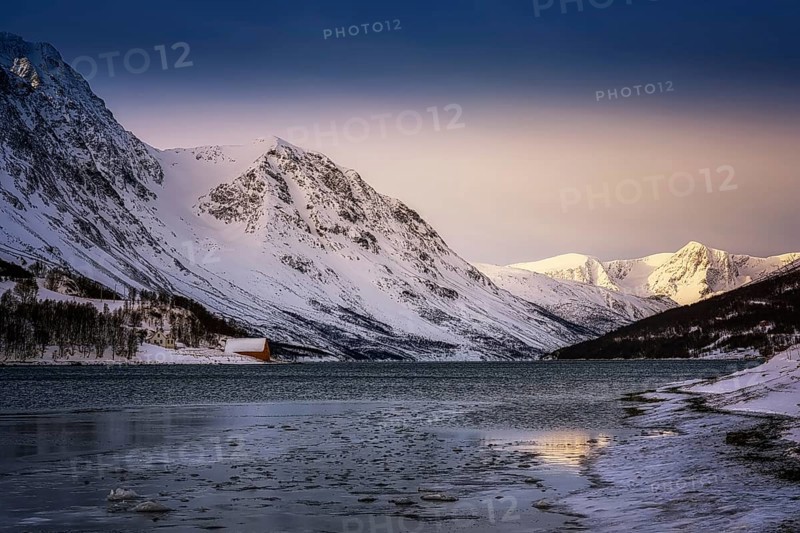 Beautiful winter landscape scene mountain in background in Northern Norway. sunset or sunrise in Mountains And Fjords
