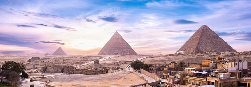 Panoramic view of pyramids and Shinx Cairo at sunset