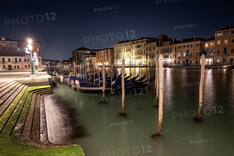 Venetian gondolas, boat dock at the customs office on the Grand Canal, Gondola Traghetto Dogana, historic facades behind, long exposure, night shot, Venice, Veneto, Italy