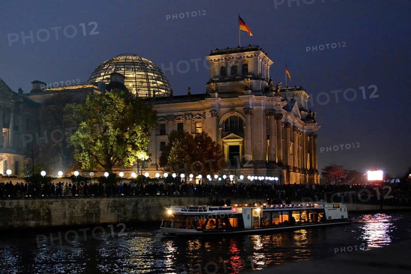 Berlin Reichstag building with light balloons of the former wall