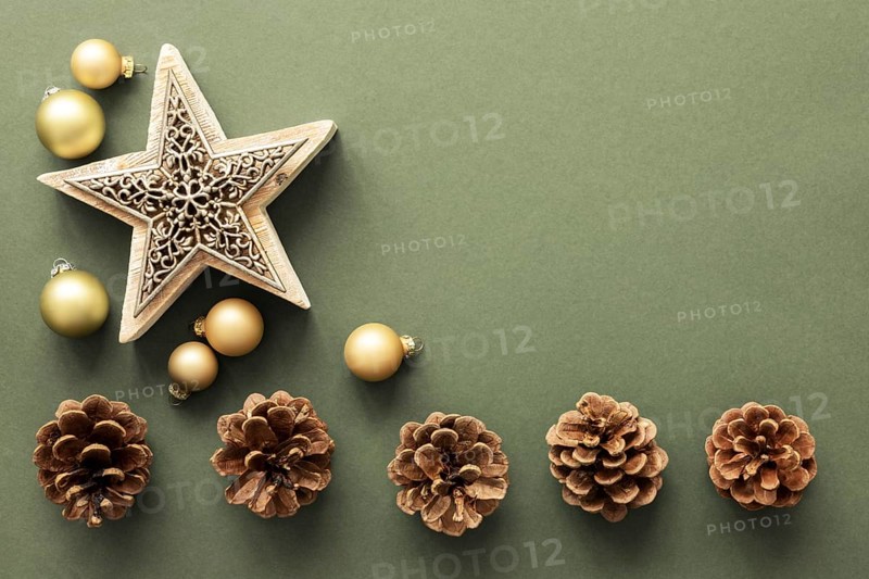 A Christmas decoration background with pine cones and a star