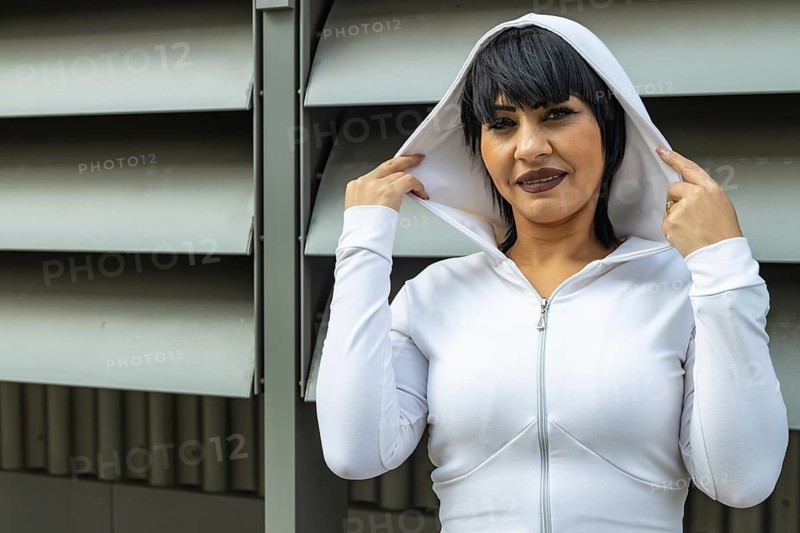 Young cute black hair woman posing with stylish hoodie