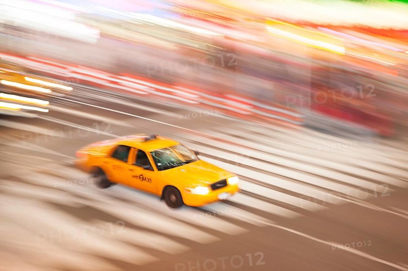 Panning image of a Yellow Taxi cab in Times Square, New York City. New York. USA